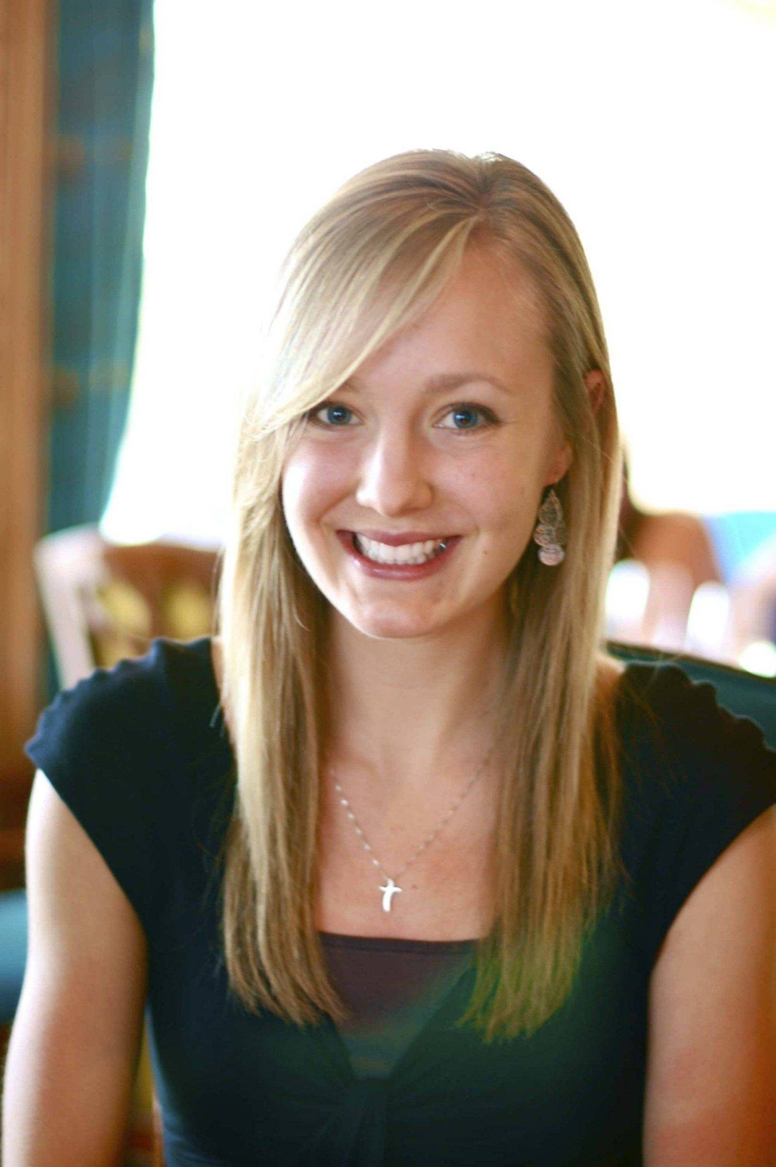 Woman smiling at camera.