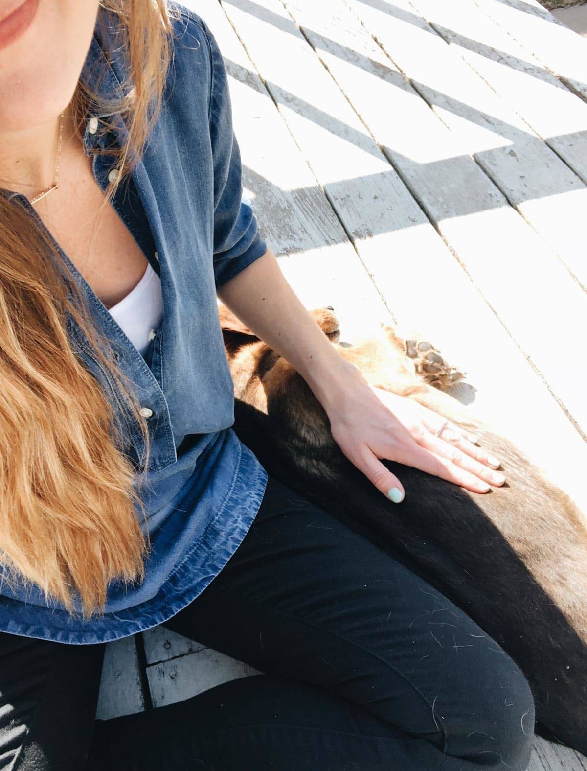 Lindsay with Sage on the deck.