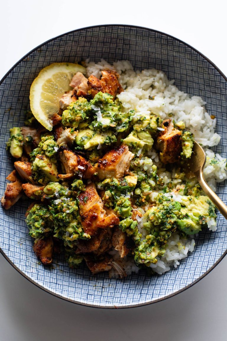 Chipotle chicken on rice with a chunky avocado sauce.