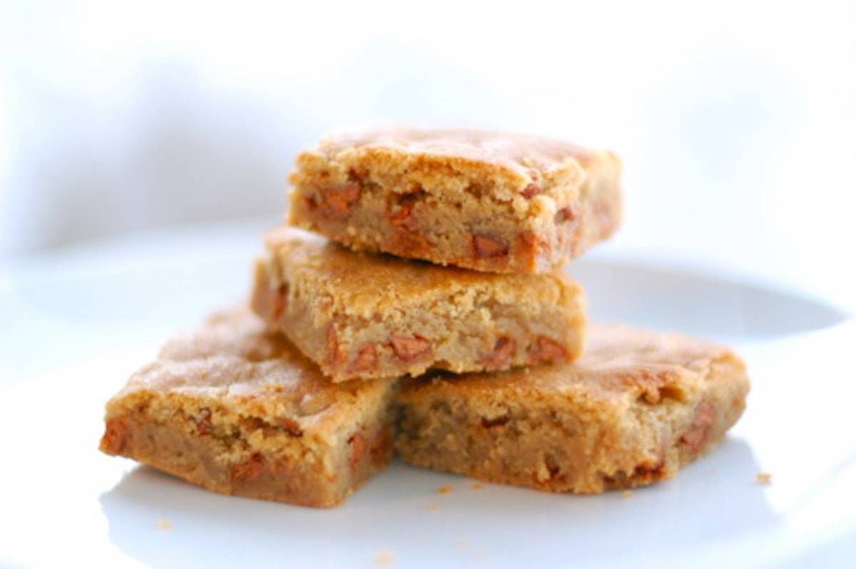 Stack of four snickerdoodle blondies. 