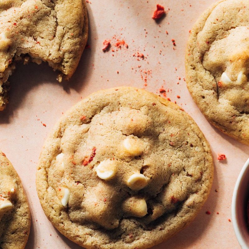 Strawberry white chocolate cookies on a pink background