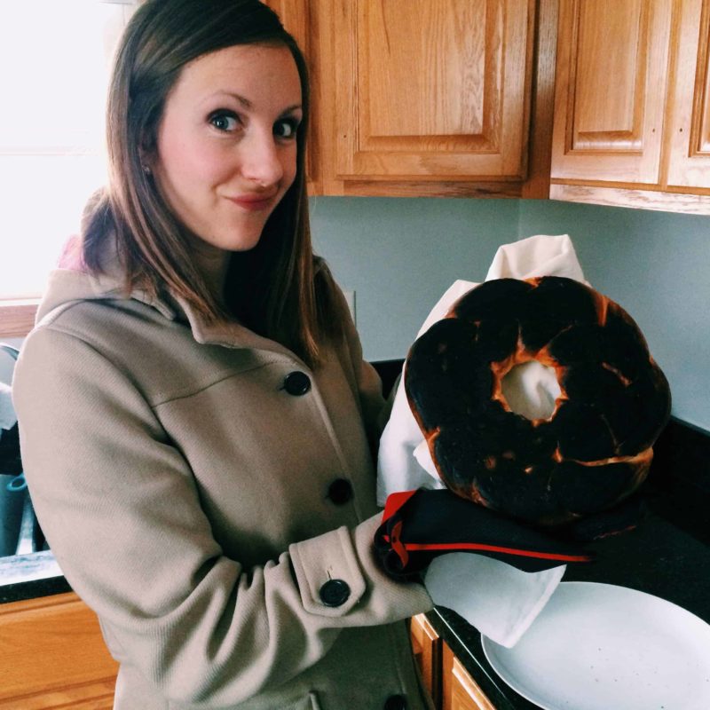 Lindsay holding a burned bundt cake.