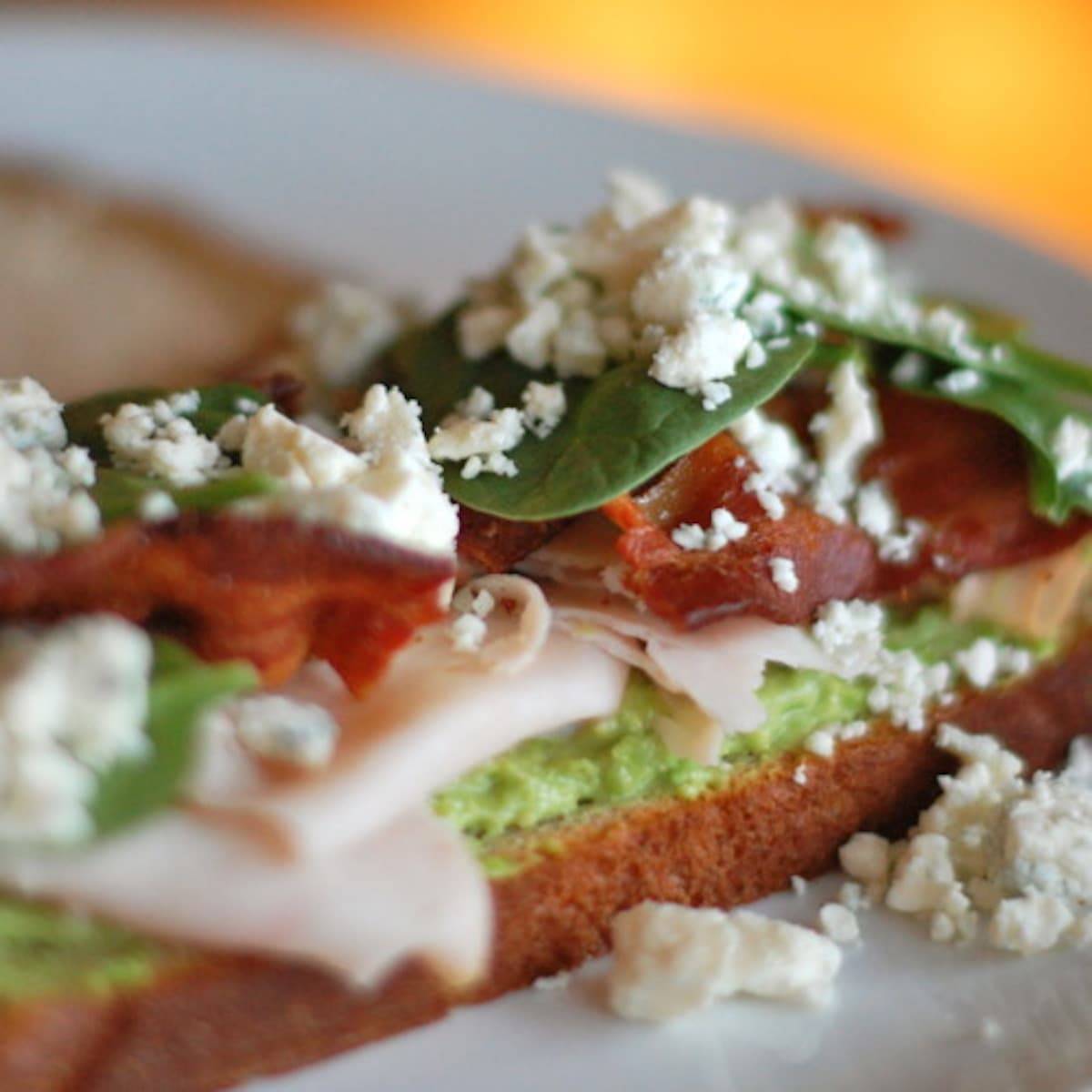 Gorgonzola and bacon panini with spinach and cheese crumbles.