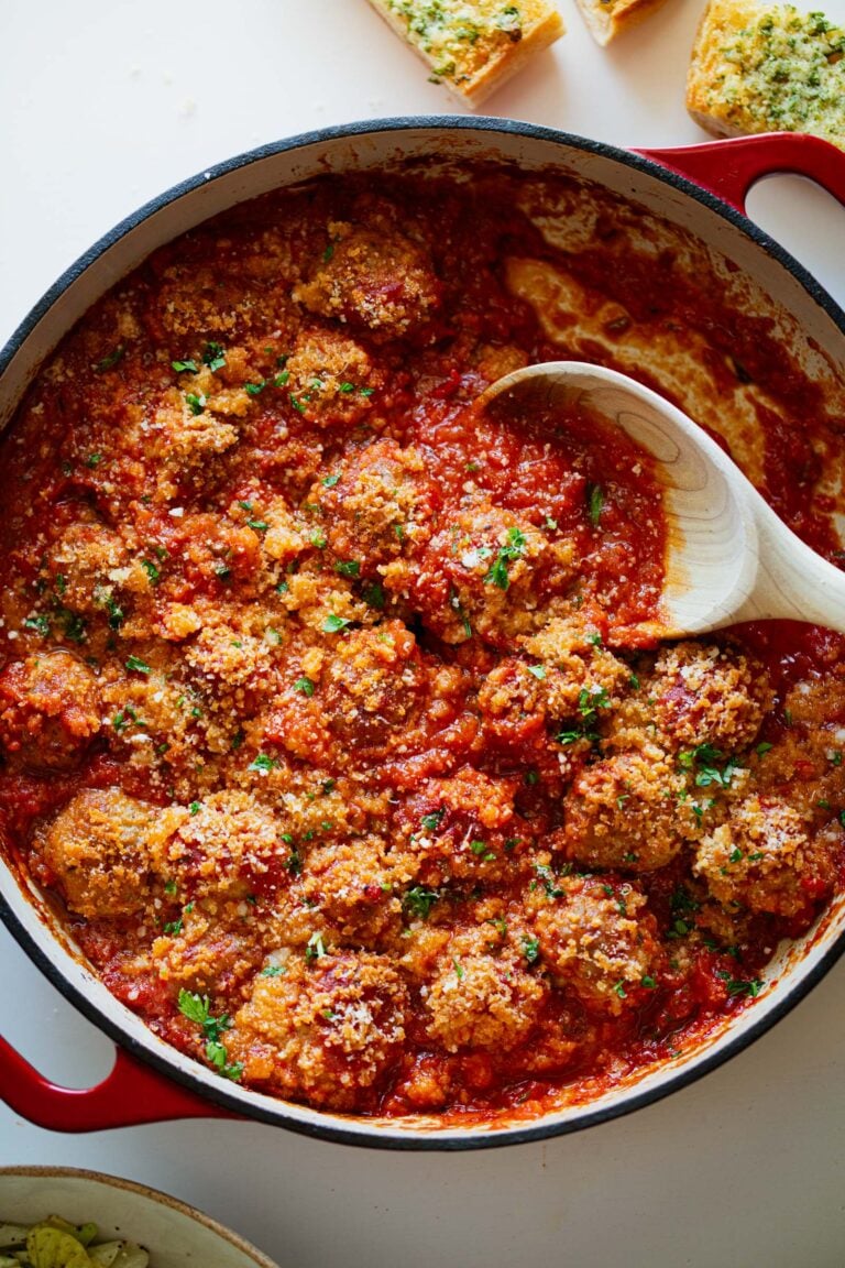 Ricotta meatballs in a skillet.