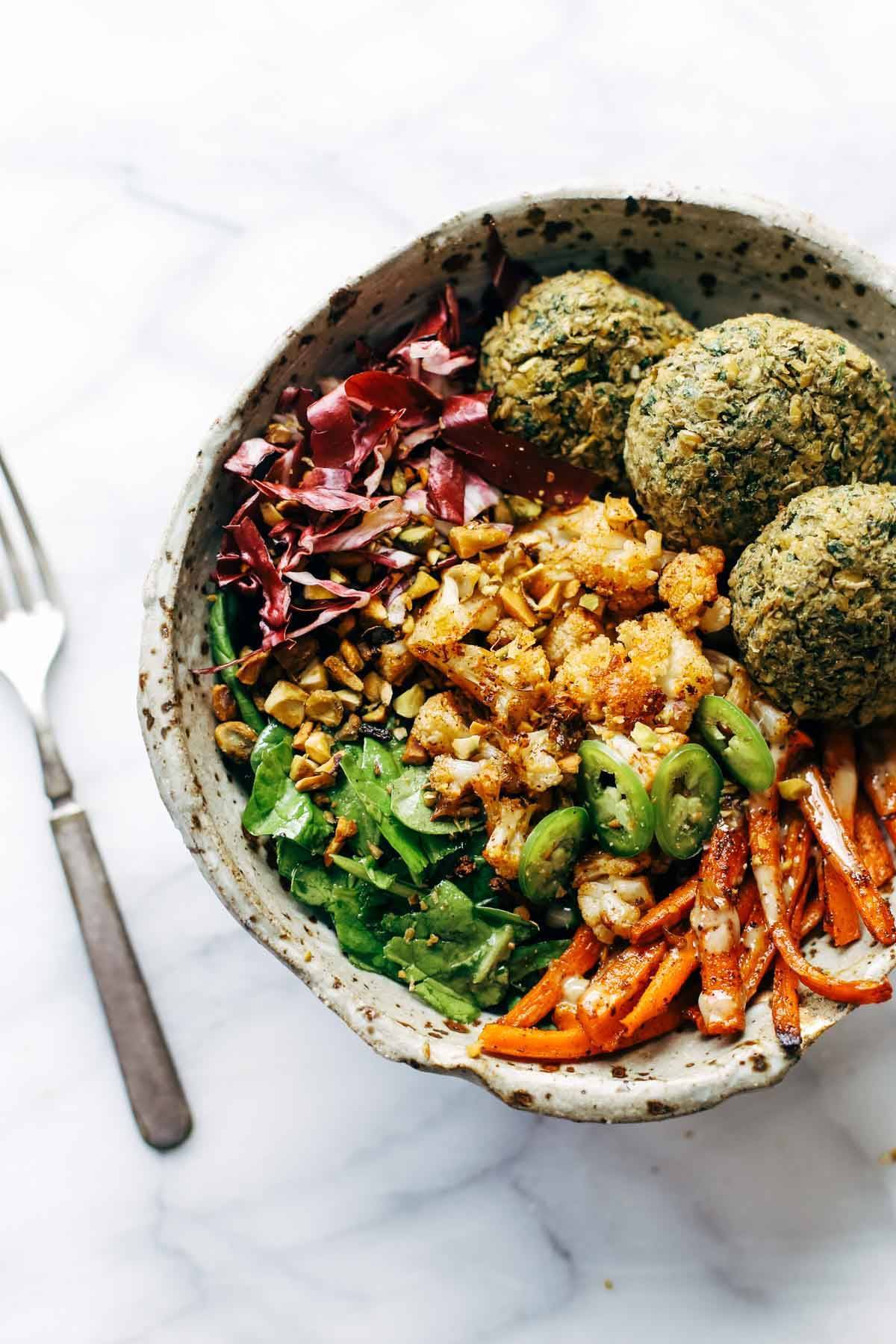 Keep your glow all winter! Easy homemade falafel, roasted veggies, and flavorful sauce all in one big bliss bowl! vegetarian / vegan / gluten free recipe. | pinchofyum.com Keep your glow all winter! Easy homemade falafel, roasted veggies, and flavorful sauce all in one big bliss bowl! vegetarian / vegan / gluten free recipe. | pinchofyum.com