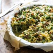 Sausage Potato Pie in a dish with parchment paper.